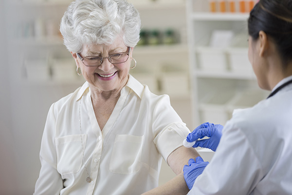 lady getting flu vaccination